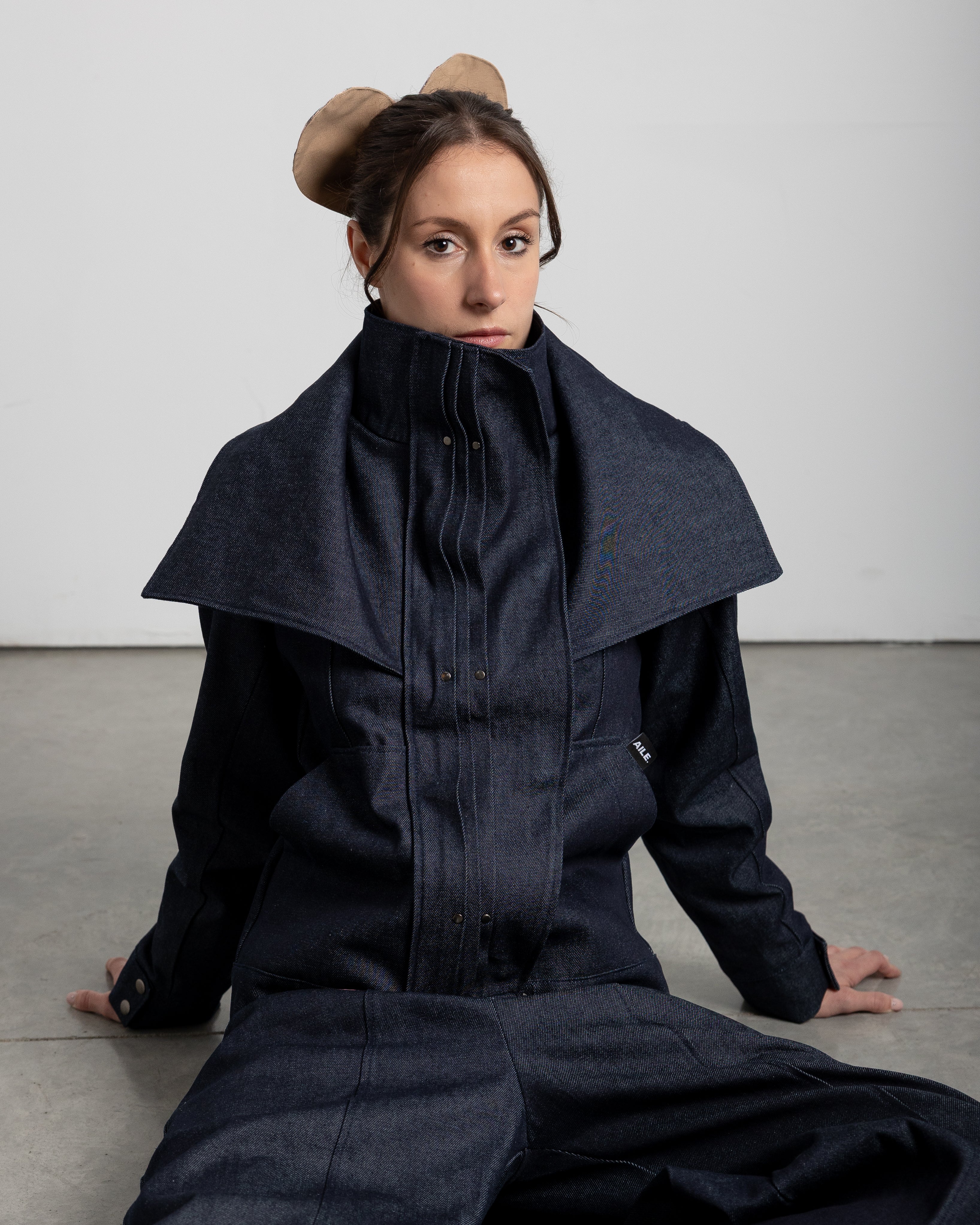 All of our garments are designed, patterned, cut, sewn, and finished by hand in a small atelier in Vigo, crafted by professionals with over 25 years of experience in the fashion industry.